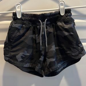 Athleta girls running shorts in black camo